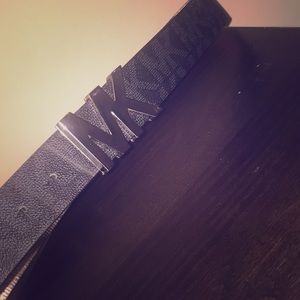 A black MK belt that has been worn 3 times